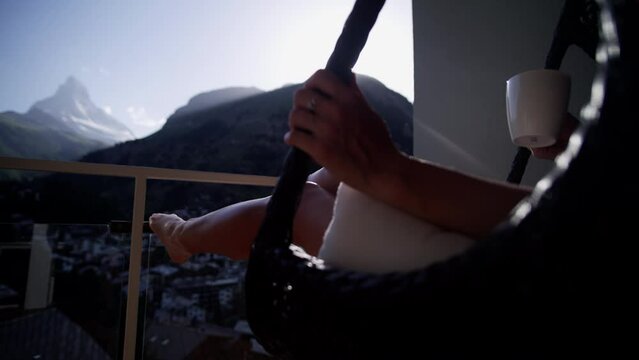 Sunset Zermatt Matterhorn resort balcony summer female relaxing 
