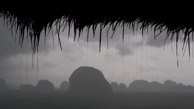 Tripod footage of karst rocks (out of focus) at heavy rain (in focus). Din Daeng Doi viewpoint, Krabi Province, Thailand.