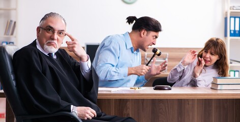 Young couple in the courthouse in divorce concept