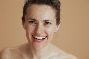 smiling woman with wet face washing