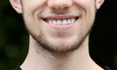 Fototapeta premium Happy Smiling man Close-up. Males Lips and white teeths. Bright Expressive Emotional Fun and Joy Lifestyle.