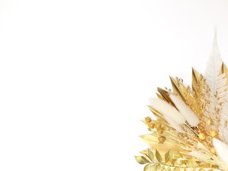 Spring card. Topper on the cake. Gold leaves of Palma and dry flowers. Flat lay. Top view. White background. High quality photo