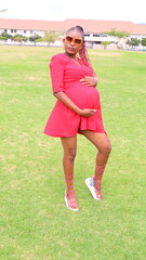 pregnant woman  in a red dress