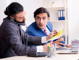 Two male colleagues in the office