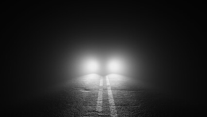 Black and white image of an ominous car parked in middle of road at night shining blinding...