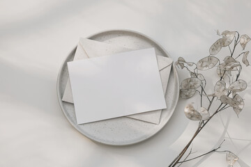Neutral floral branding, wedding stationery. Blank greeting card, beige envelope mock up. Dry...