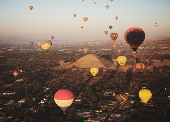 Sunrise hot air balloon flight over the ancient city of Teotihuacan and its pyramids in Mexico