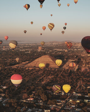Sunrise hot air balloon flight over the ancient city of Teotihuacan and its pyramids in Mexico