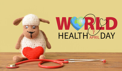Stethoscope, heart and toy sheep on table. World Health Day