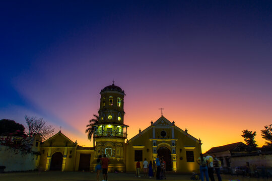 sunset in front of the church of santa barbara in mompox