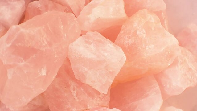 rose quartz background.pink natural stone.approximation rotation. 4k footage