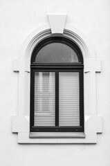 View of white building with black window