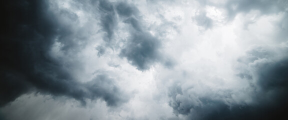 Dramatic cloudscape texture. Dark heavy thunderstorm clouds before rain. Overcast rainy bad weather. Storm warning. Natural gray background of cumulonimbus. Nature backdrop of stormy cloudy sky.