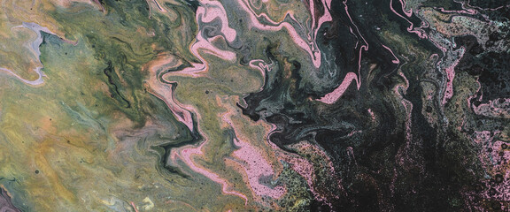 Dirty fluid art background with dark green, orange and pink tints and black stains. Eerie effect of...