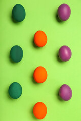 Painted Easter eggs on green background