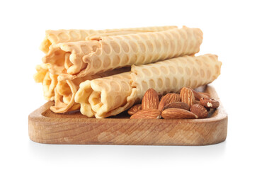 Board with delicious wafer rolls and almond nuts isolated on white background