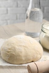 Cooking scones with soda water. Dough and ingredients on white wooden table