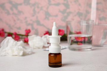 Nasal drops on white table. Seasonal allergy concept