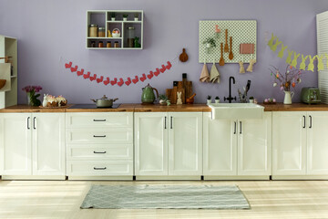 Interior of modern kitchen decorated for Easter celebration