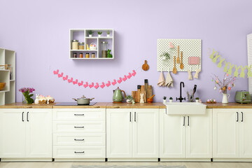 Interior of modern kitchen decorated for Easter celebration