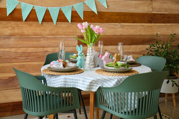 Interior of dining room with table served for Easter celebration