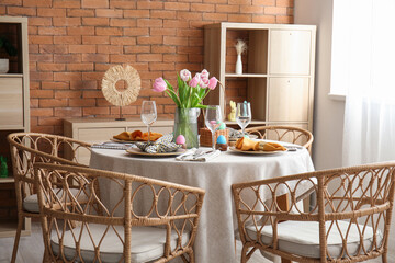 Interior of dining room with table served for Easter celebration
