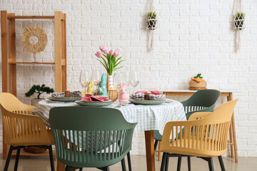 Interior of dining room with table served for Easter celebration
