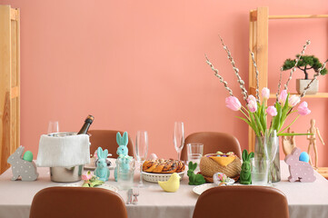 Interior of dining room with table served for Easter celebration