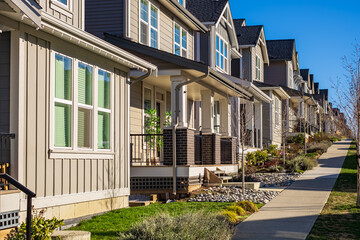 Residential building Real Estate Exterior Front Houses in Canada. A perfect neighbourhood. Houses in suburb at spring