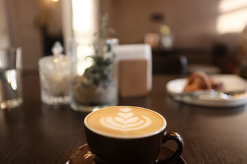 a cup of coffee in a cafe, photo morning coffee luvak cappuccino