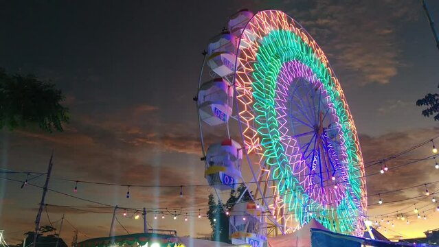 BKT Ferris wheel side sunset sky colorfull