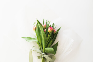 Bouquet of pink fresh tulips. Beautiful Card for Mother's Day or Women's Day.