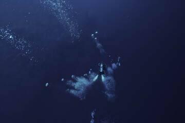 Fototapeta na wymiar diver scuba depth blue lonely