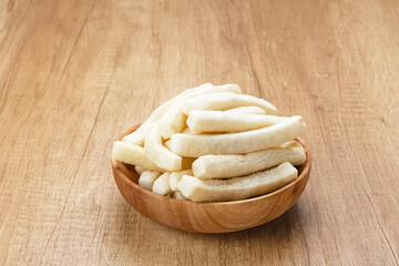 Krupuk or Kerupuk, Indonesia traditional crackers, served on wooden bowl
