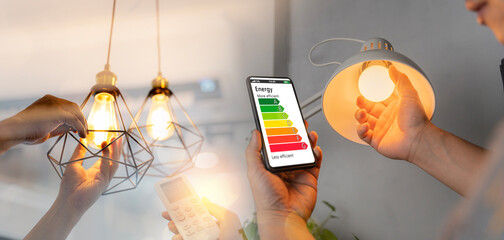 Man change a new electric bulb, hand using remote control open air conditioning 26 degrees make a home more energy efficient. Home appliance energy efficient. - Powered by Adobe