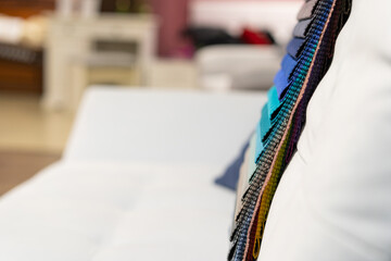 Obraz premium Tissue catalog. Catalog of multi-colored fabric samples. Textile industry background. Colored cotton fabric. Tissue catalog. Selects the color of the sofa. Textile industry background. Palet