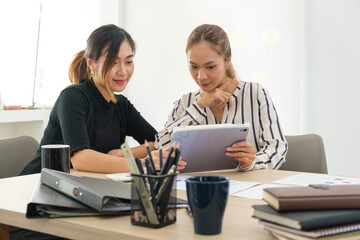 Obraz premium Image of female colleagues discussing results or presenting new project on laptop.