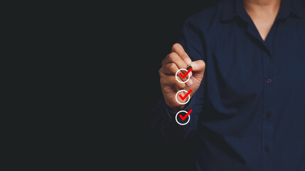 Businessman holding a pen and checking a mark on circle symbol is one of three options while...