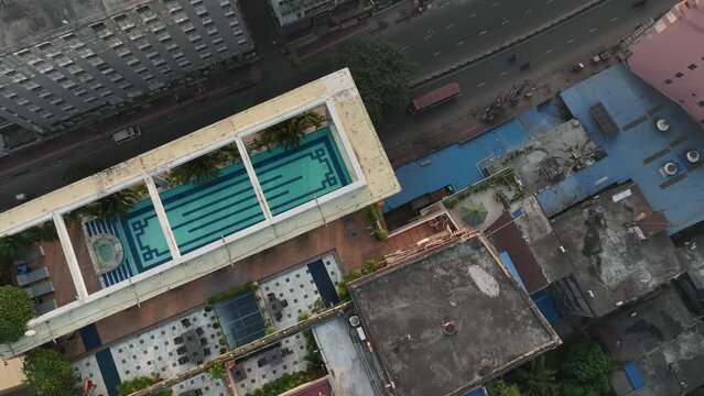 Aerial view of apartment building with a swimming pool on the roof in Dhaka. Bangladesh.