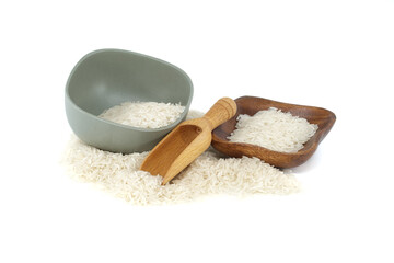 Dry rice in wooden bowl over white background