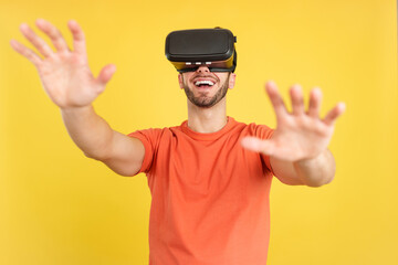 Happy caucasian man with Virtual Reality goggles