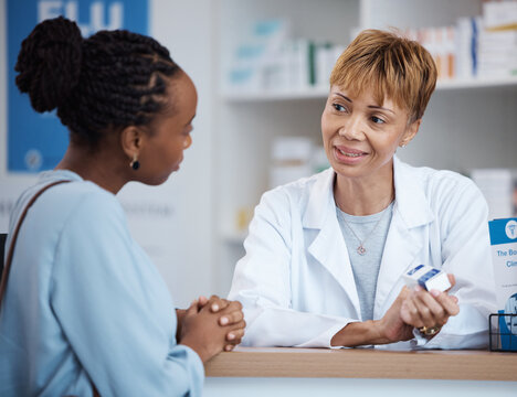 Healthcare, help and black woman with pharmacist at counter for advice on safe medicine and prescription drugs. Health, pharmaceutical info and patient consulting medical professional at pharmacy.