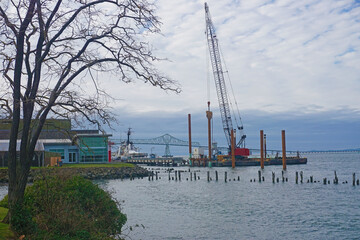 Photo of a pile driver in the Columbia river in Astoria, Oregon.