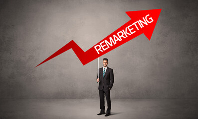 Young business person in casual holding road sign