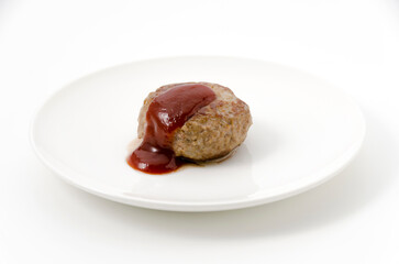 ソースのかかった手作りハンバーグ