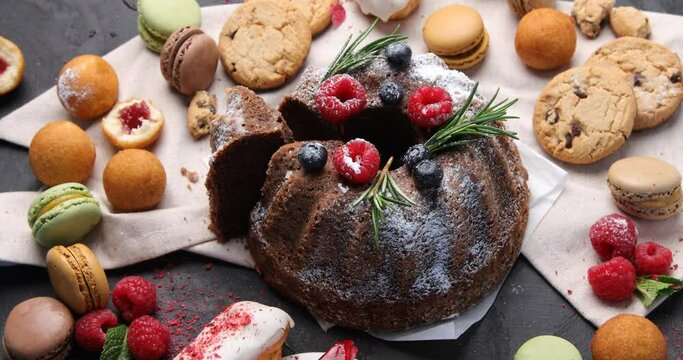 Variety of delicious confectionery products. Holiday cake. Top view, rotation. Sweet desserts table