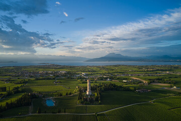 The famous tower on lake garda tower of san martino della battaglia in the background of lake...