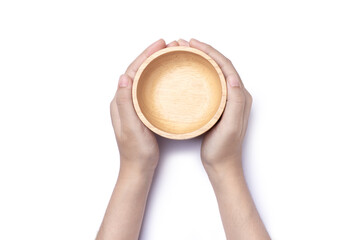 Woman hand holding empty wooden bowl isolated on white background with clipping path, top view, flat lay.