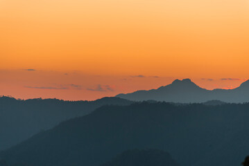 Sunset mountain range beautiful landscape mist, dusk golden time dramatic sky. Beautiful landscape high mountain ridge mist panning panorama scenery dawn dramatic sky. Sunrise landscape mountain peak.