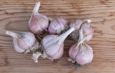 Garlic on wooden background. Top view. Healthy food concept